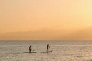 Water recreation at sunset
